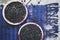 Two mulberry pies on purple textile - overhead