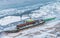 Two multicolor fishing boats trapped on frozen river Danube