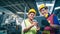 Two multiethnic industrial workers looking at tablet in the warehouse.