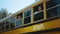 Two multiethnic pupils looking out school bus window. Teenagers ready to studies