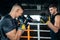 Two muscle boxers sport man training and fighting on boxing ring at gym