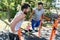 Two muscular young men doing bodyweight exercises in a modern fi