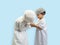 Two Muslim boy in a dress Greeting each other, isolate background