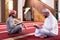 two muslim people in mosque reading quran together concept of islamic education