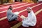 two muslim people in mosque reading quran together concept of islamic education