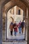 Two Muslim women are approaching archway of bridge, Isfahan, Ir