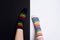 Two nagative legs with white and black striped colorful socks with negative background with copy space