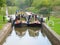 Two narrowboats entering a canal lock