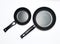 Two new non-stick pans on a white background.