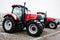 Two new red tractor stay at snowy weather