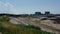 Two Nuclear AGR reactor Power stations close to families on beach. Heysham. UK