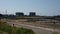 Two Nuclear AGR reactor Power stations close to families on beach. Heysham. UK