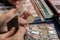 Two numismatists examines collection of coin