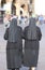 Two nuns with black long dresses and a veil to cover the hair th