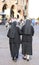 Two nuns blacks with long dresses and a veil to cover the hair