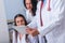 Two nurses  female physicians  and a male doctor looking in a tablet at the doctor`s office while discussing a medical report