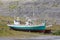 Two old boats lying on the beach in patrekfjordur westfjords