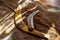 Two old boomerangs laying on the kangaroo skin, fur with wooden glossy table in the background. Souvenirs from Australia on