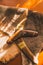 Two old boomerangs laying on the kangaroo skin, fur with wooden glossy table in the background. Souvenirs from Australia on