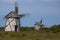 Two old dutch type windmills on the field