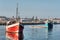 Two old fishing ships in harbor