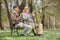 Two old friends sitting on a wooden bench