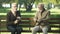 Two old men relaxing and having fun in park of nursing home, happy memories