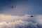 Two old planes cross a stormy sky during an exhibition during the Melun-Villaroche airshow