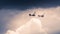 Two old planes cross a stormy sky during an exhibition during the Melun-Villaroche airshow