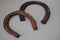 Two old rusted horseshoes