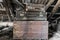 Two Old, Rusty, Dusty and Dirty Suitcases Lying on the Brown Chest in Attic