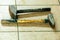 Two old sledge hammers hand tools in mechanic garage car service