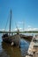 Two old sloop boats moored at the pier