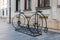 Two old time big wheel bicycles rack