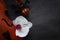 Two Old violins and white orchid flower. Top view, close-up on dark concrete background