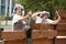 Two old Women shouting over the garden fence