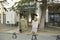 Two old women standing on the street and selling handmade shawls