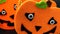 Two Orange felt pumpkin-shaped dolls for halloween holidays, detailed view