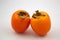 Two orange Kakis Persimmon