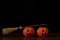 Two orange pumpkins and a witch broom