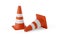 Two orange traffic warning cones or pylons on white background - under construction, maintenance or attention concept