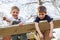 Two ornery boys on swing