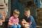 Two orphans were left homeless and sitting near the ruins of the building as a result of a military conflict, a fire and an earthq