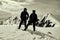 Two other tourists on the snow-capped mountain top