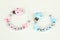 Two pacifier chains in blue and pink