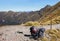 Two packed backpacks on hiking track in New Zealand