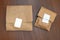 Two packed paper bags sealed with a white sticker are on the table. The concept of using environmentally friendly packaging. The