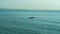 Two paddler kayak blue sea and the mountains behind