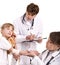 Two paediatrician treat happy child. Medicine.