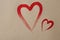 Two Painted heart outline on craft paper background